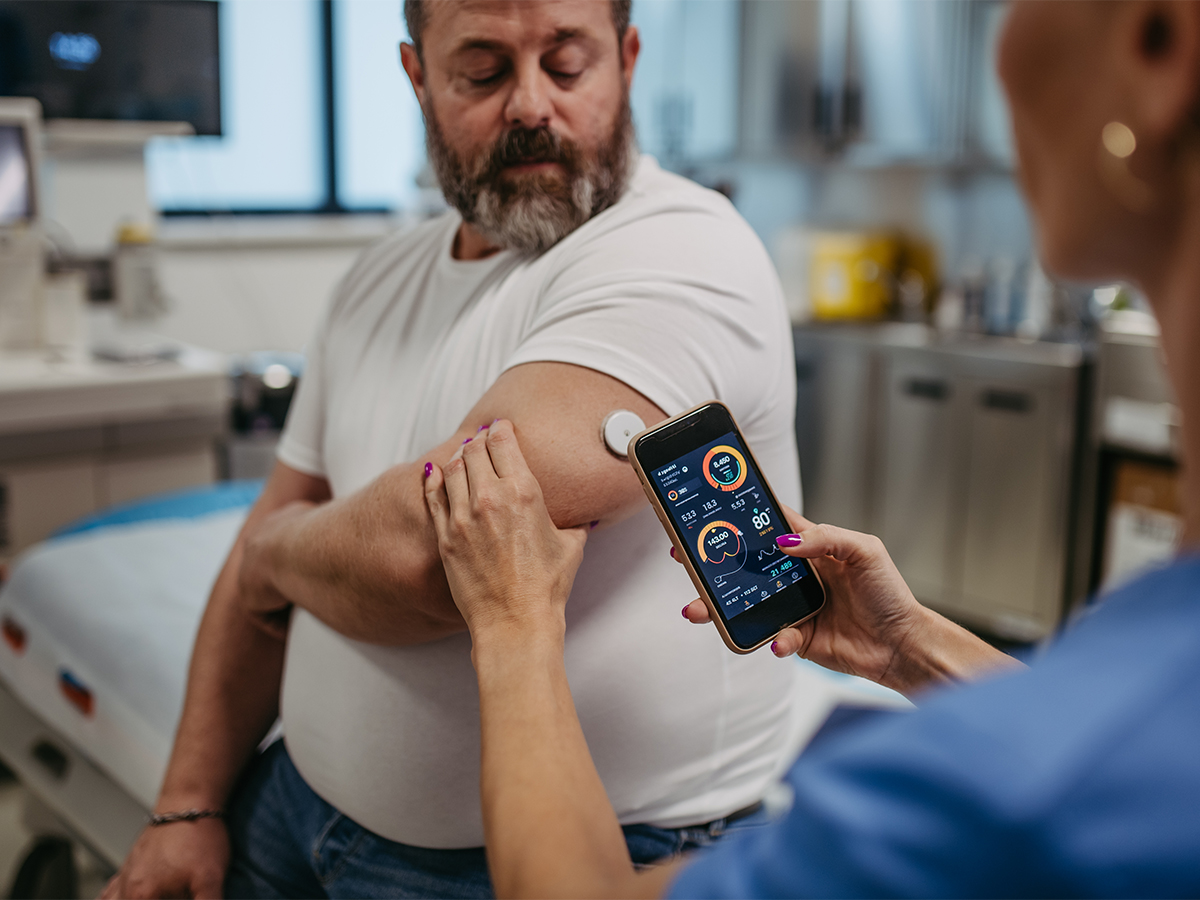 Man getting blood glucose test with CMS